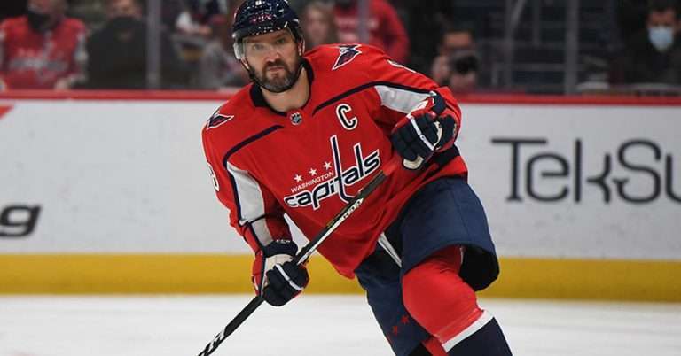 Arlington VA 26 Washington Capitals hockey player in red uniform skating on the ice during a game at Capital One Arena in Washington, D.C.