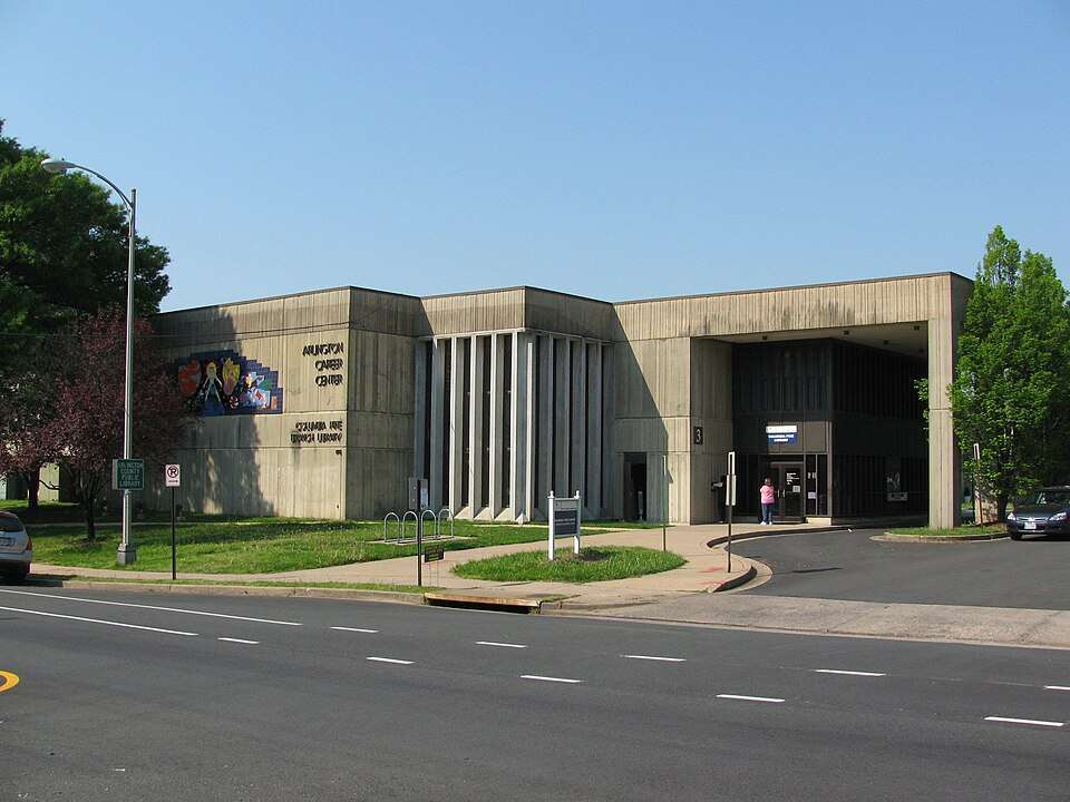 Arlington VA 45 Modern concrete building with colorful mural, labeled "Arlington Career Center/Columbia Pike Branch Library," people entering.