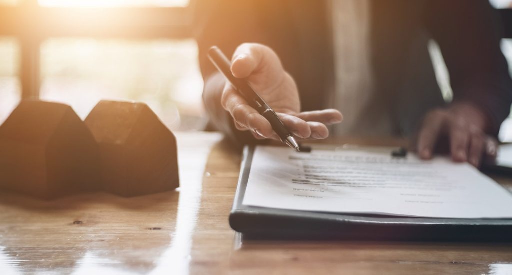 Real estate management team member with documents