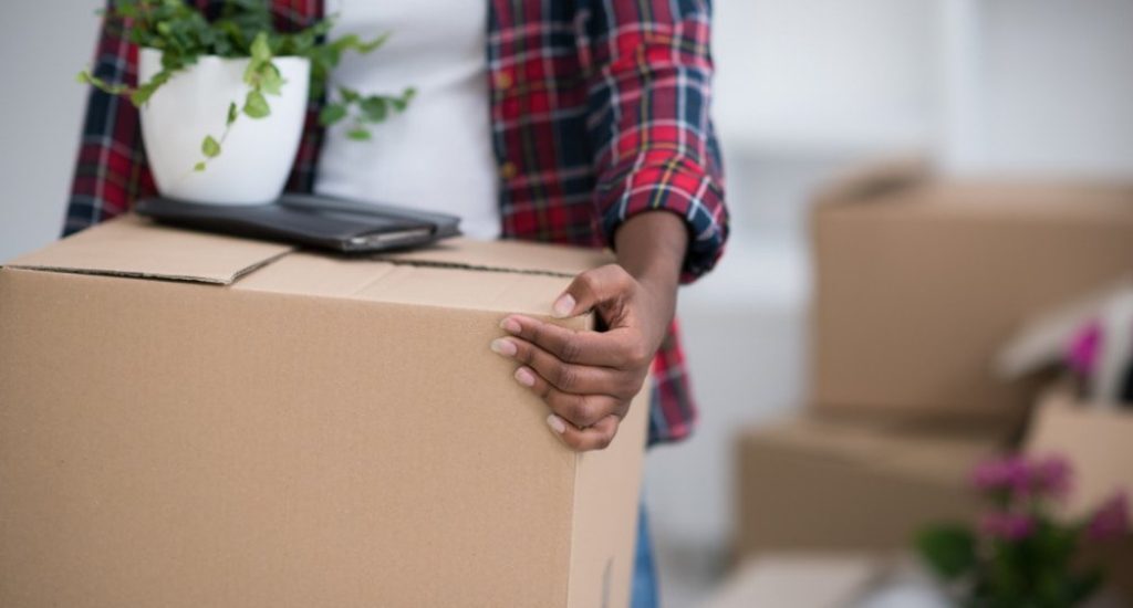 Person moving to rockville holding box