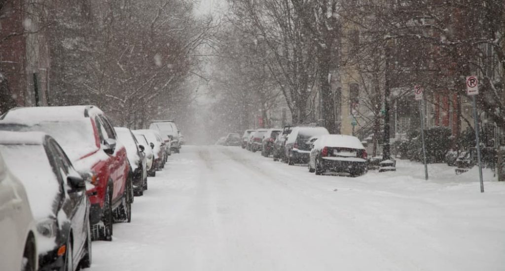 A snowy neighborhood required to follow the snow removal laws D.C. has in place