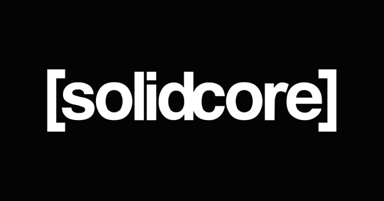 The [solidcore] logo displayed in bold white text on a solid black background, featuring the brand name enclosed within square brackets, representing the boutique fitness studio chain.