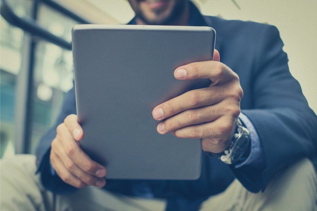 Someone working a tech job via an iPad in Northern Virginia