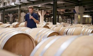 10 Interesting Things to Do in Fairfax County 19 Young man wine tasting in a wine factory warehouse